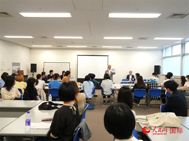 活动报告会现场。人民网 许可摄